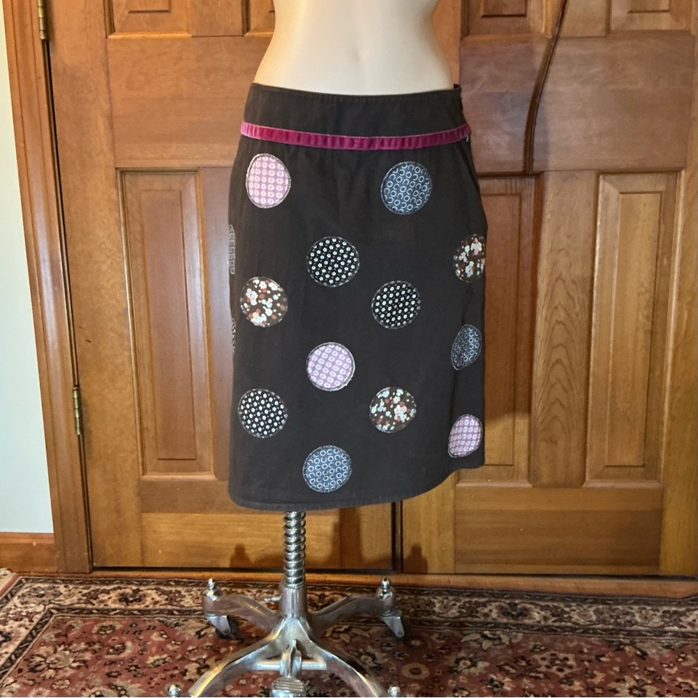 Stylish Brown Skirt with patch Patterned Accents and velvet band on waist.